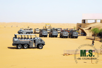 //ilrorwxhonpplo5m-static.micyjz.com/cloud/lkBpiKoklrSRiljnpjljjo/desert-cruiser-bus-in-tourism-area.jpg
